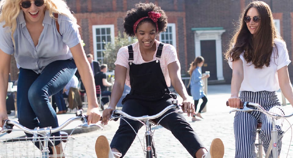 Harrogate Spring Water lifestyle photography of girls on a bike