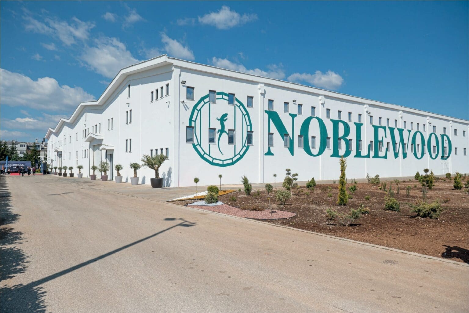 Noblewood Beluga Vodka Distillery image of their new distillery with the branding on the side of their new offices